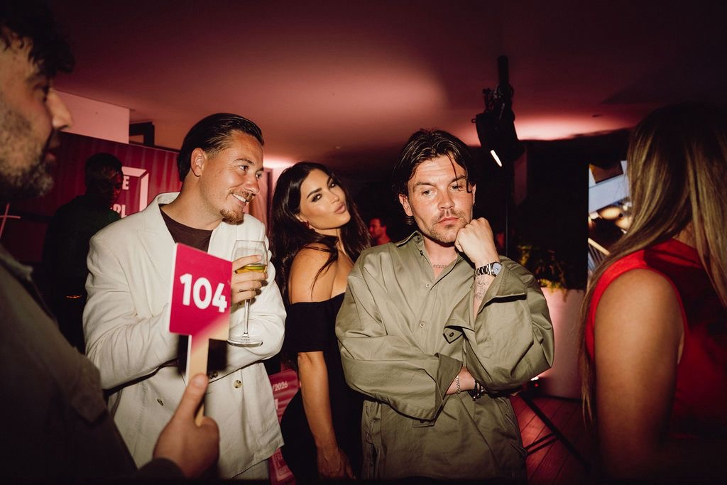 Guests bidding at the live auction with paddle 104