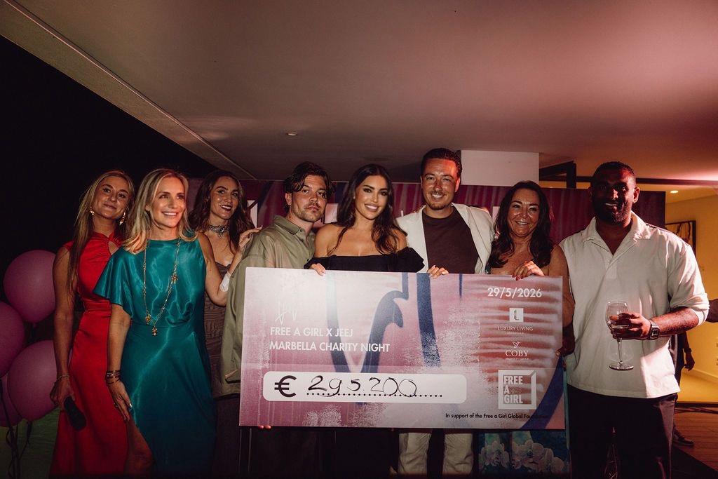 Coby Property Group and JEEJ team presenting a €295,200 cheque to Free a Girl
